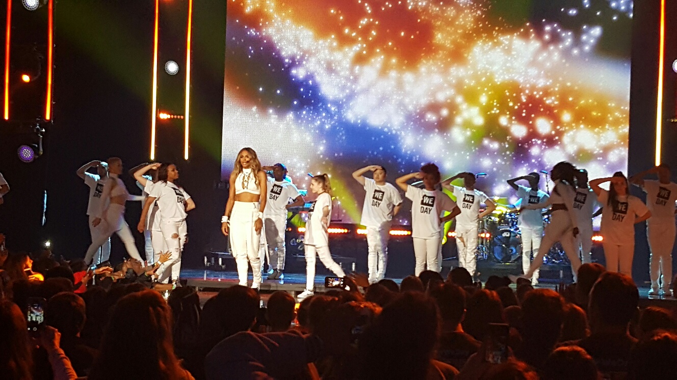 Young Endure performers gathered on a stage