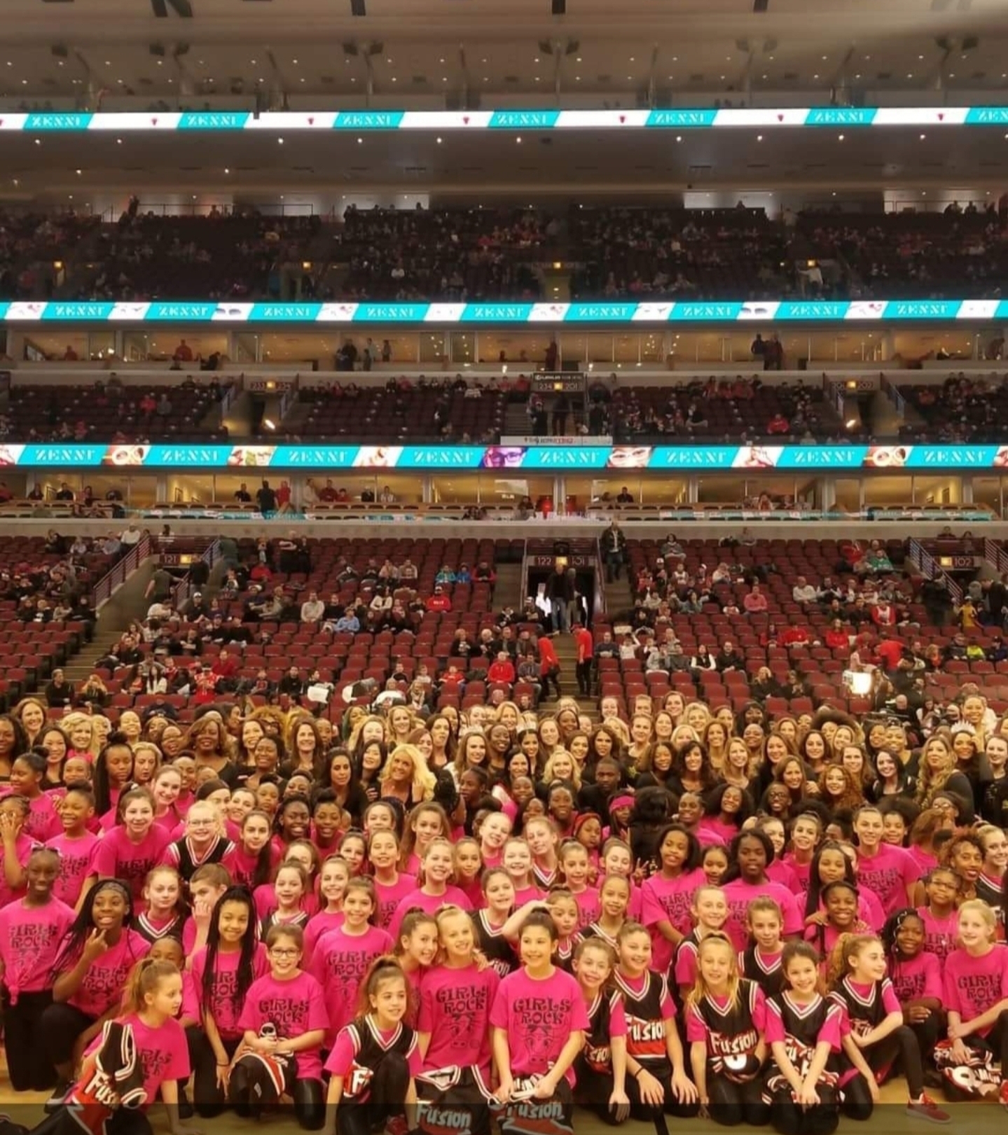 Students gathered on the United Center floor with Endure